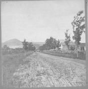 SA0408 - Photograph shows a general view of buildings and a road.